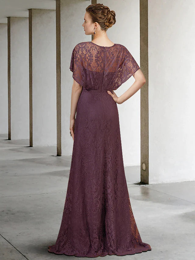 Woman modeling a pleated lace short sleeve formal gown.
