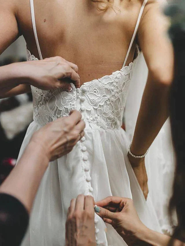 Side view of the romantic wedding gown, highlighting the flowing skirt and appliques.