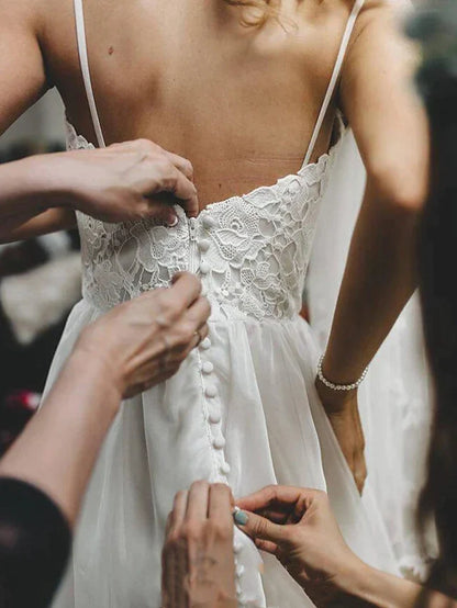 Side view of the romantic wedding gown, highlighting the flowing skirt and appliques.