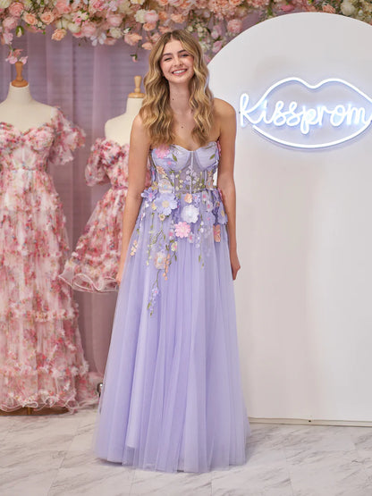 Close-up of 3D flower embellishments on a lavender tulle dress.
