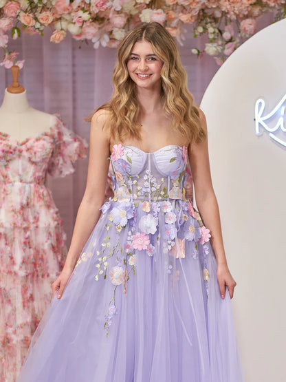 Back view of a lavender A-line strapless tulle dress.