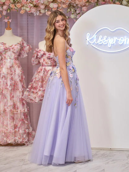 Model twirling in a lavender A-line strapless tulle dress.