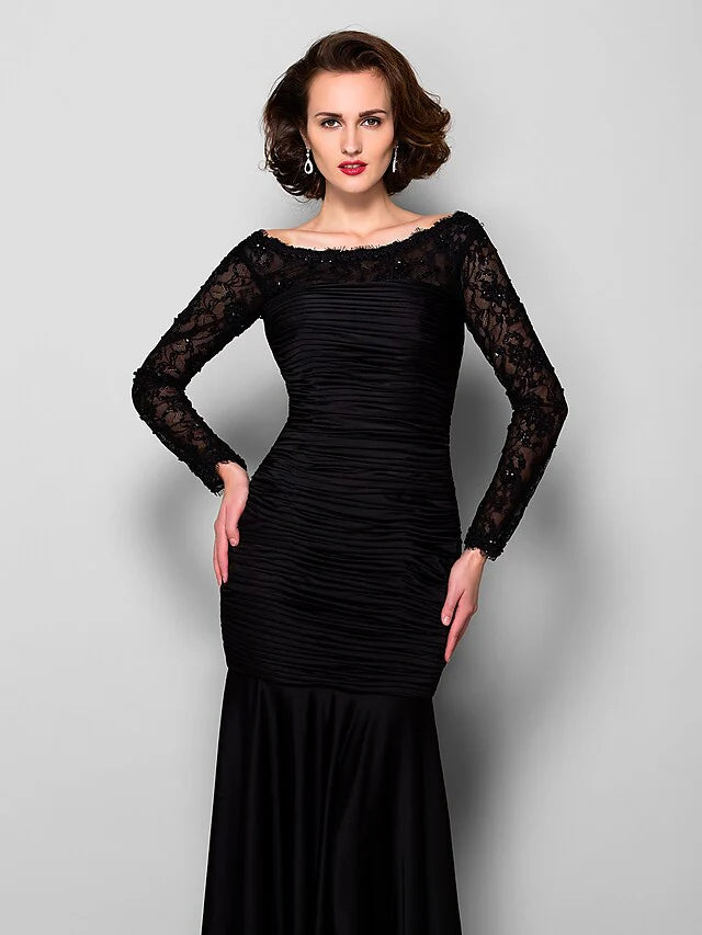 Side profile of the long sleeve lace Mother of the Bride gown.