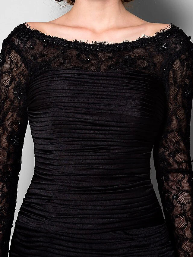 Another angle of the beautiful back of the long sleeve Mother of the Bride dress.