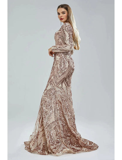 Close-up of the V-neckline and long sleeves with lace and sequin embellishments.