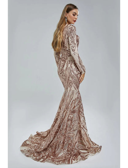 Detailed view of the lace and sequin patterns on the elegant evening gown.
