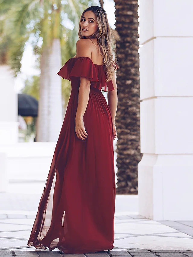 Close-up of the ruched detailing on the side of the party dress.
