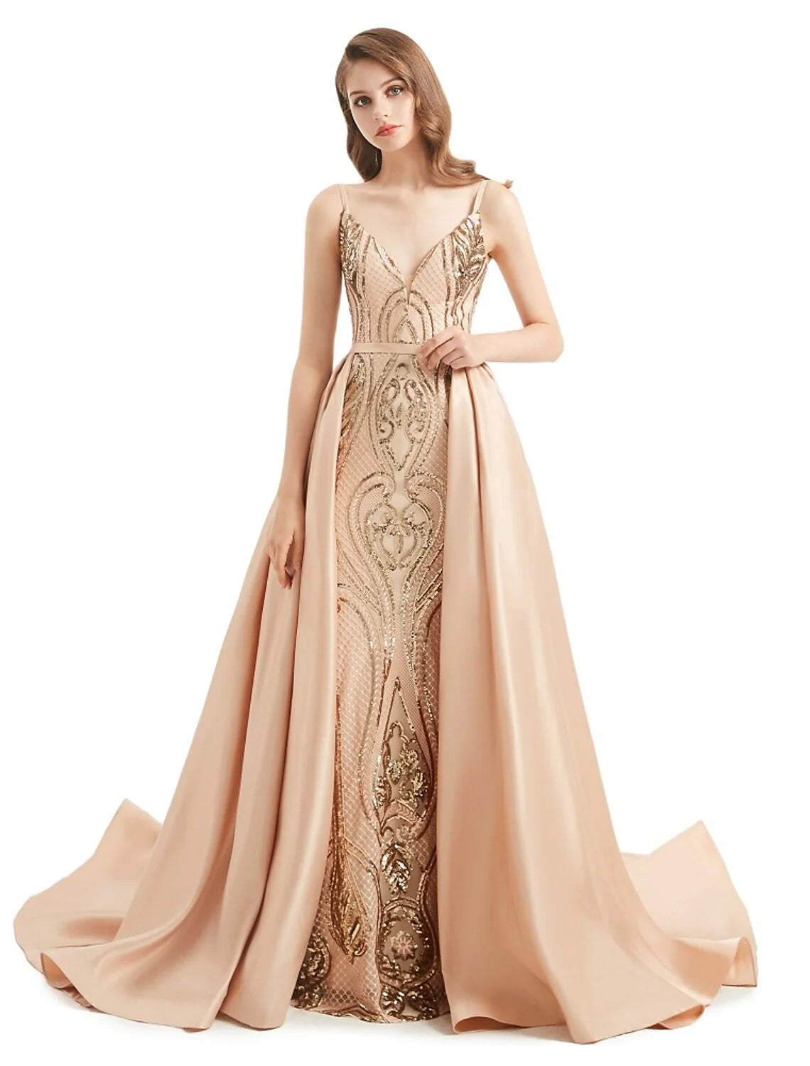 Woman wearing an elegant sequined mermaid trumpet evening gown with V-neck.