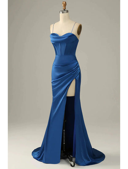 Elegant sleeveless mermaid trumpet evening gown in satin with cowl neck and ruched detailing.