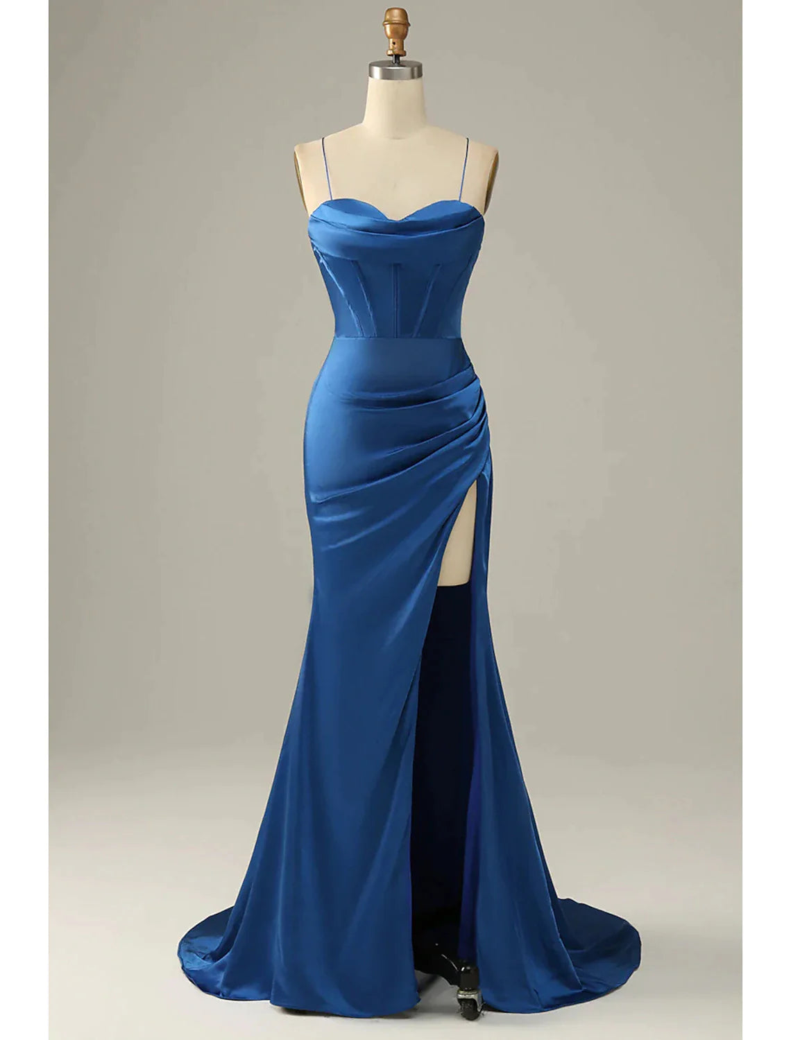 Close-up of the cowl neck and ruched satin fabric on a formal evening dress.