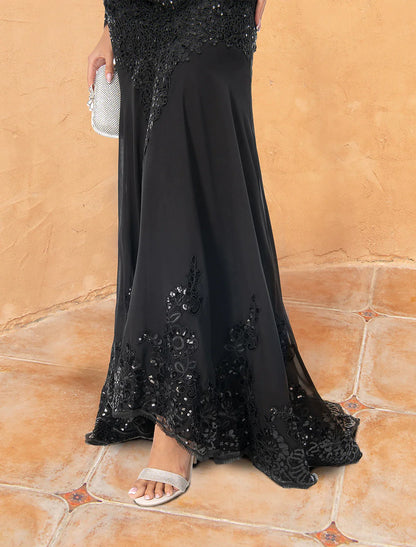 Side profile of woman wearing the formal long sleeve evening dress.