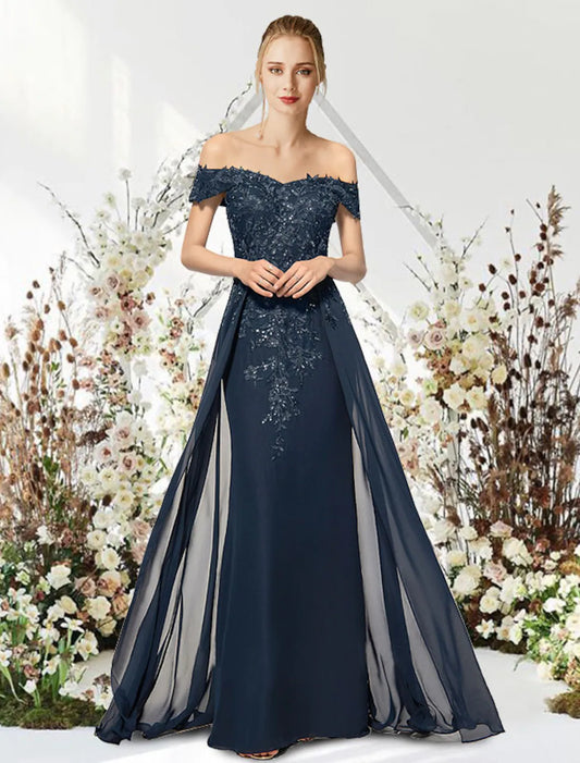 Elegant off-shoulder mermaid trumpet gown with intricate beading and appliques, worn by a model.
