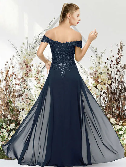 Close-up of the off-shoulder neckline and beaded applique detail on the back of the mermaid gown.