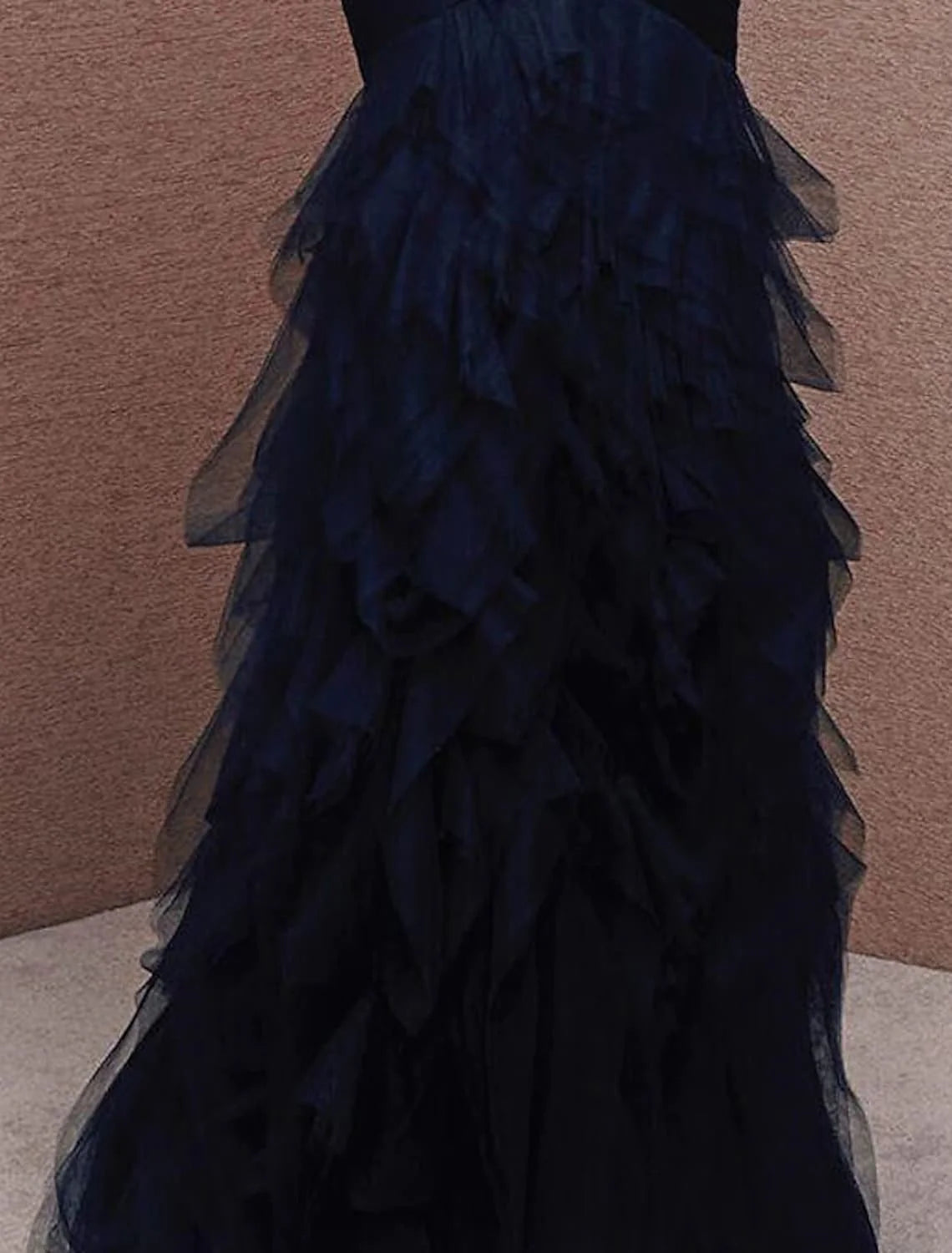 Sophisticated strapless evening dress with intricate ruched detailing.