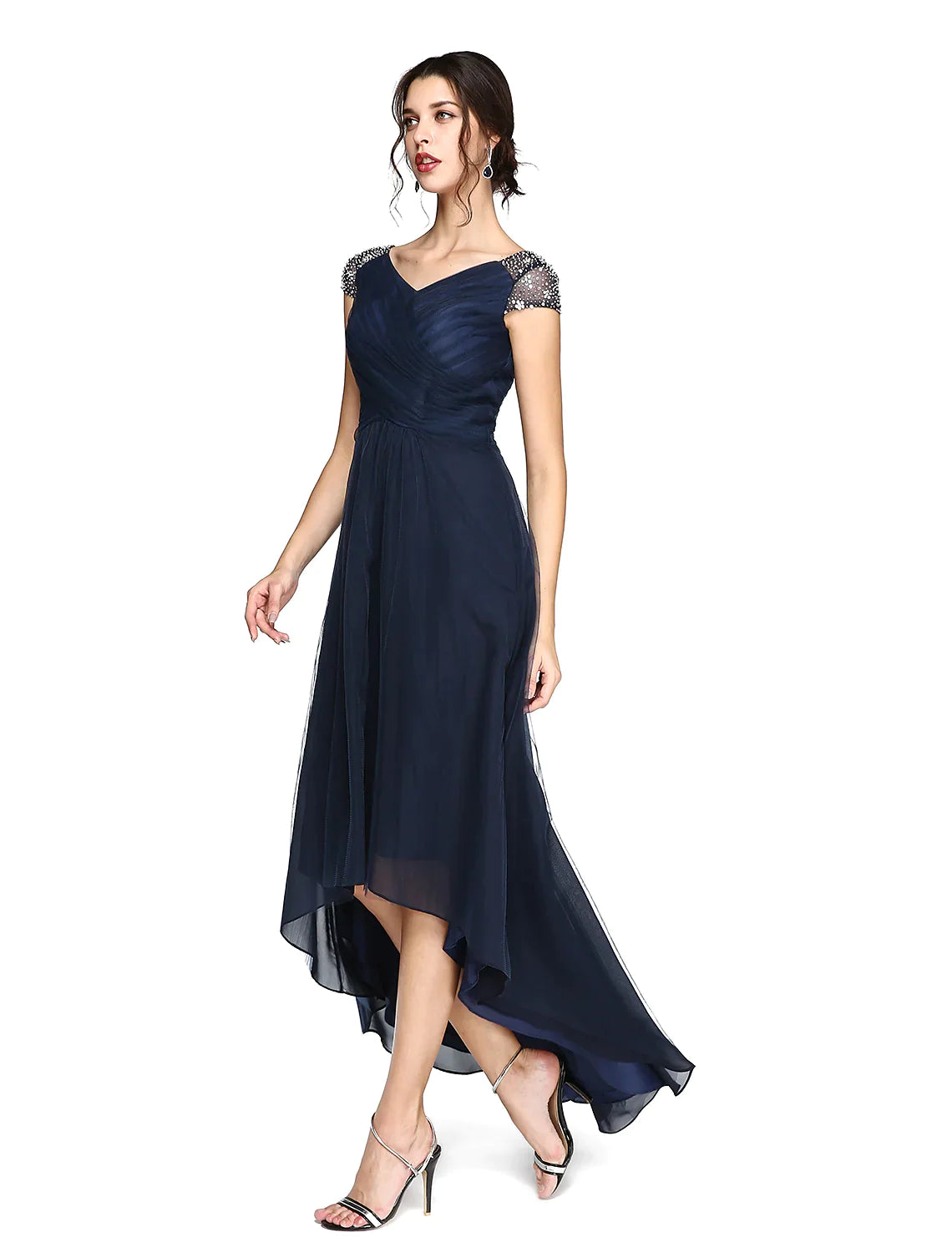Front view of a model showcasing the V-neck and pleated details of the light-colored sheath column dress.