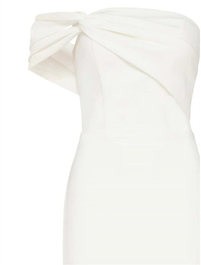 Woman walking, showcasing the stretch fabric and slit of the one-shoulder homecoming dress.