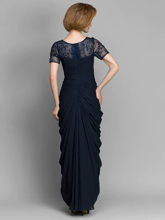 Side view of the navy chiffon mother of the bride dress with short sleeves and ruched detailing.