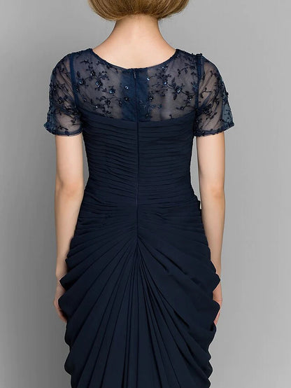 Detailed view of the short sleeve and fabric texture of the navy formal dress.