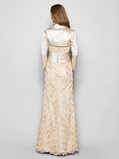 Side view of the navy blue mother of the bride dress, showcasing the flowing floor-length skirt and sleeve detail.