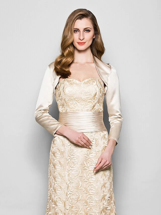 Close-up of the sweetheart neckline and intricate lace bodice of the navy blue mother of the bride dress.
