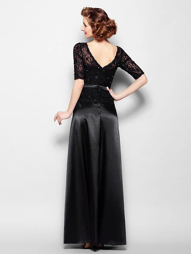 Side view of a woman in a navy blue floor-length formal dress, showcasing the stretch satin fabric.