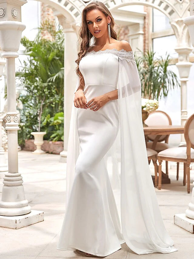 Close-up of the off-shoulder neckline and intricate lace details on the wedding dress bodice.