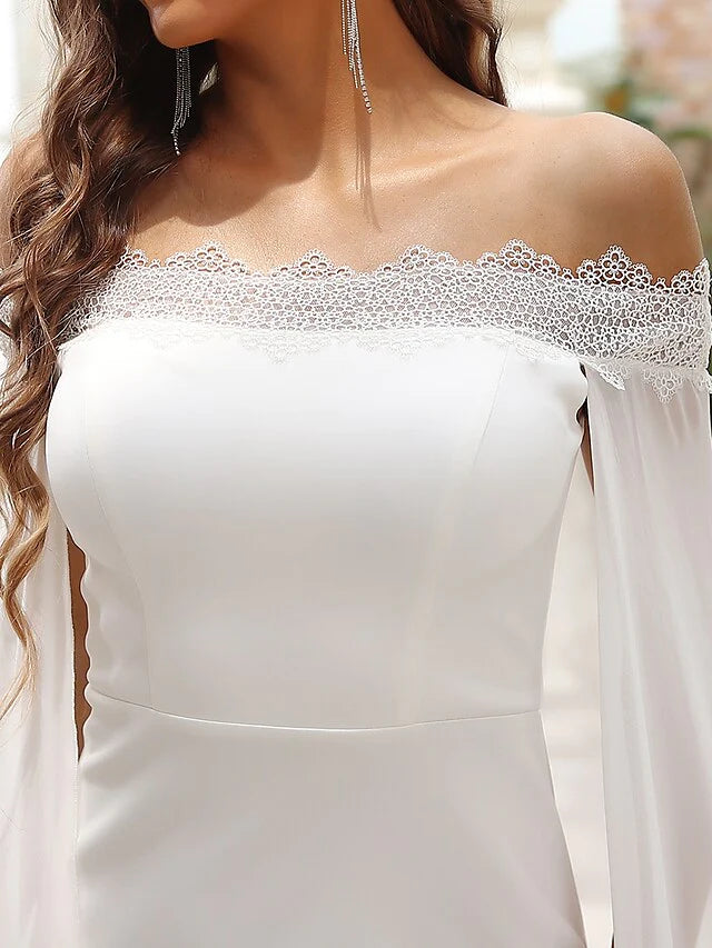 Full length view of the elegant off-shoulder A-line bridal gown.