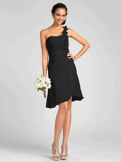 Model wearing an elegant one-shoulder knee-length chiffon bridesmaid dress with side draping and a flower detail.