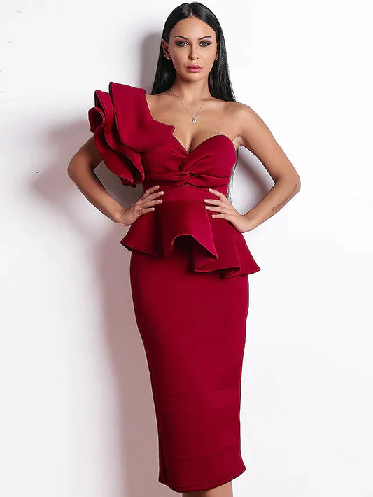 Woman wearing an elegant one-shoulder ruffled tea-length cocktail dress.