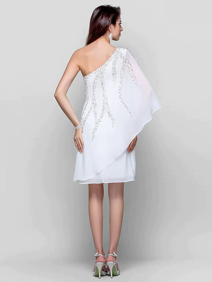 Back view of a model in a white sequin one-shoulder knee-length dress.