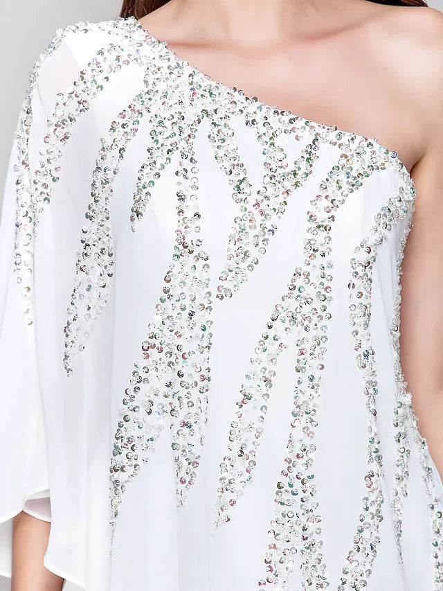 Side view of a model posing in a white sequin chiffon party dress.