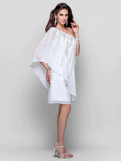 Close-up of the sequin detail on a white one-shoulder dress.
