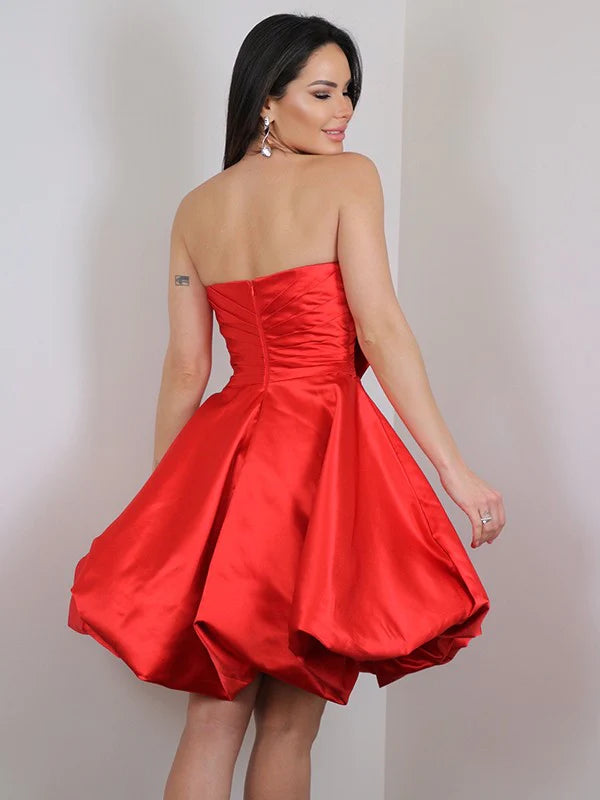Back view of a pink A-line satin mini dress, showcasing the delicate bowknot detail.