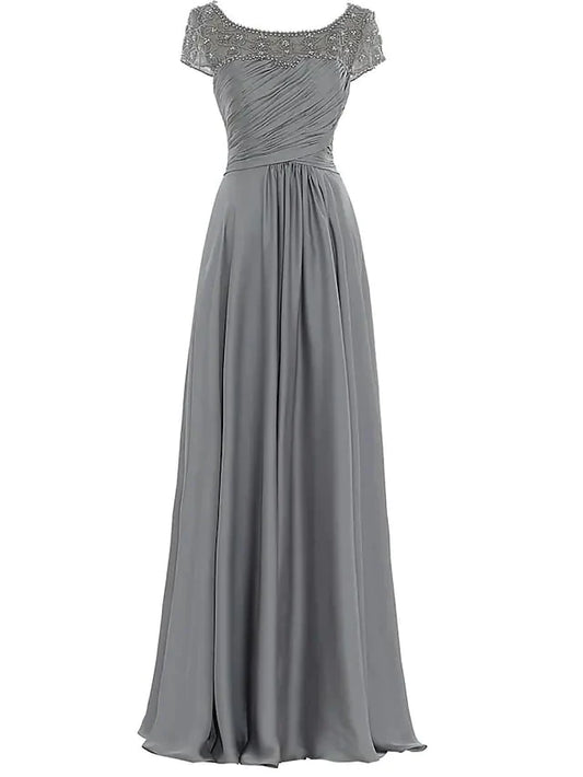 Model wearing an elegant floor-length chiffon Mother of the Bride dress with a jewel neck, pleats, and beading.