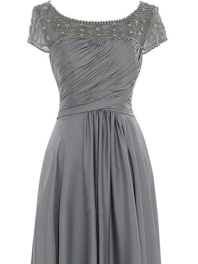 Back view of the elegant floor-length chiffon Mother of the Bride dress, showing the flowing fabric and silhouette.