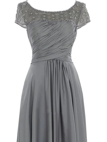 Back view of the elegant floor-length chiffon Mother of the Bride dress, showing the flowing fabric and silhouette.