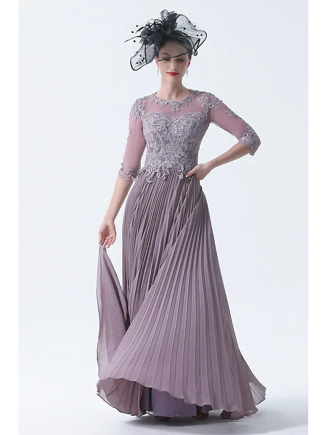 Model wearing an elegant plus size A-line Mother of the Bride dress with bateau neck and half sleeves.