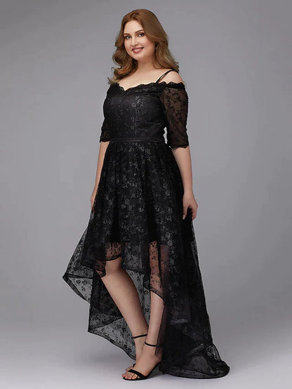 Plus size model wearing an elegant navy blue A-line spaghetti strap cocktail dress with asymmetrical lace and pleats.