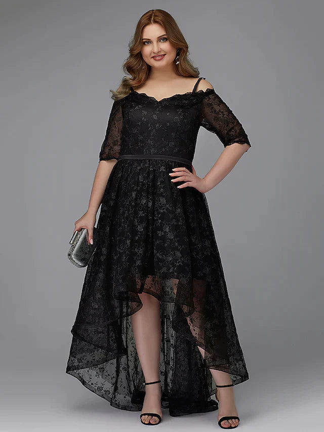 Close-up of the asymmetrical lace and pleated skirt on the navy blue cocktail dress.