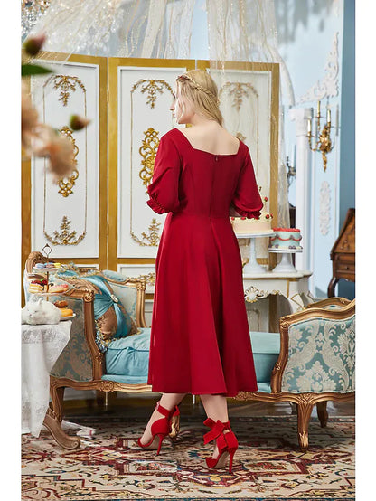 Close-up of the V-neck and half sleeves on the elegant A-line dress.