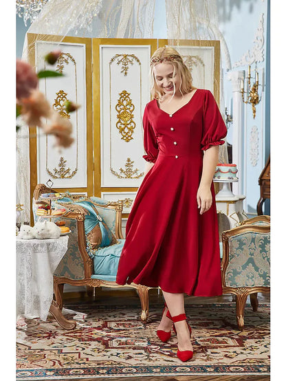 Back view of the A-line dress showing pleats and button details.