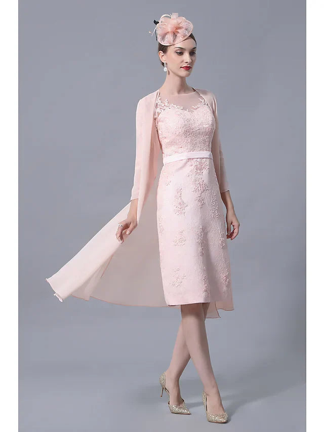 Close-up of delicate lace appliques on the dress bodice.