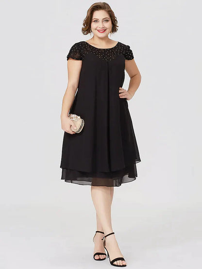 Full length view of the plus size black formal dress, highlighting the silhouette.
