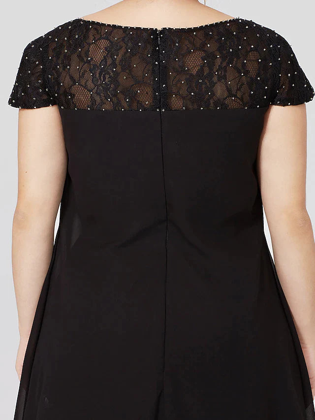 Another angle of the black plus size formal dress, showcasing fabric flow.