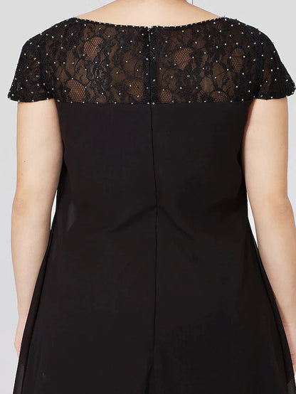Another angle of the black plus size formal dress, showcasing fabric flow.