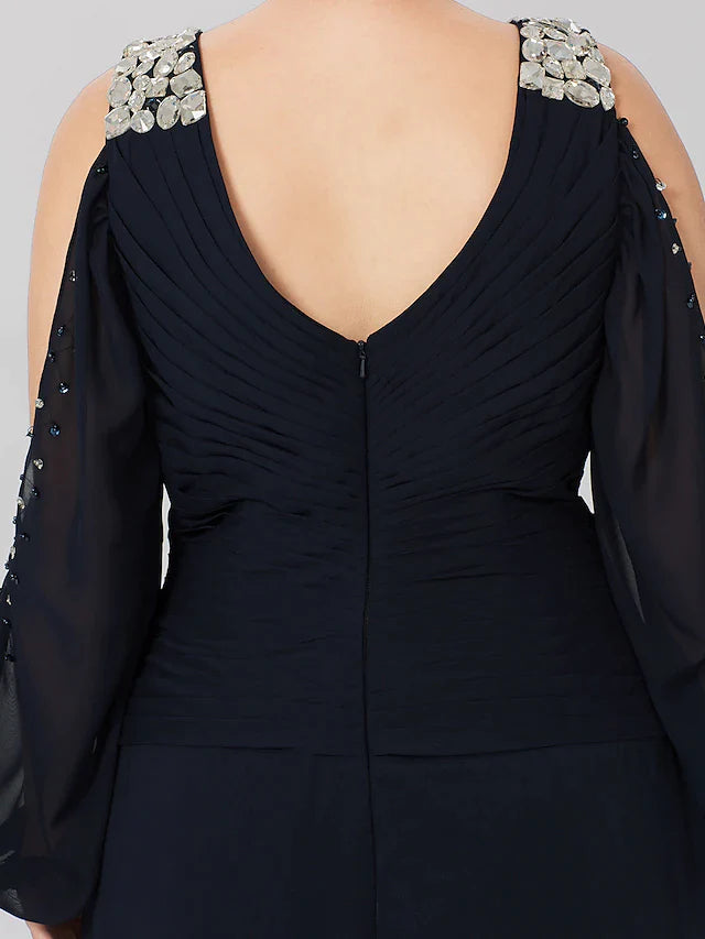 Woman modeling the sophisticated plus size Mother of the Bride gown.