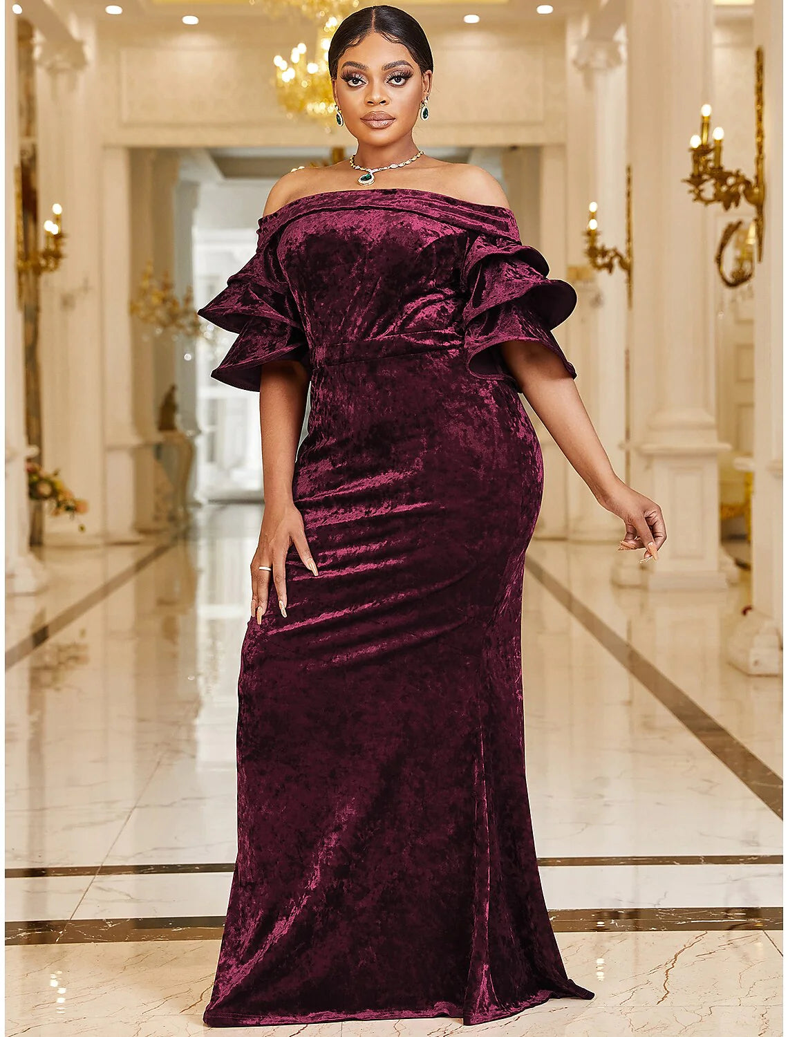 Close-up of off-shoulder velvet neckline and ruffle detail on the dress.