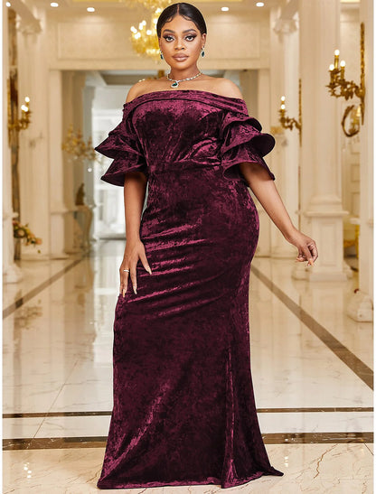 Close-up of off-shoulder velvet neckline and ruffle detail on the dress.