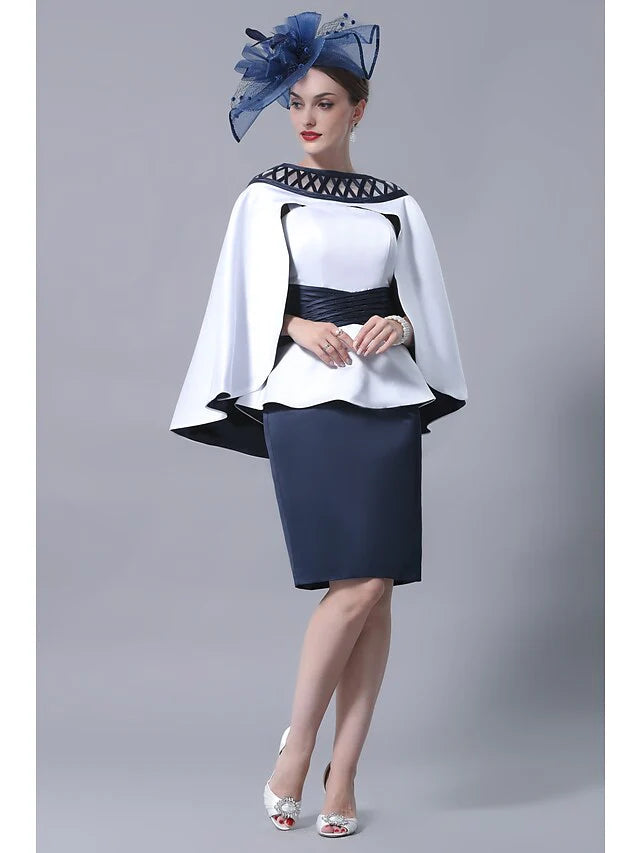 Woman wearing an elegant plus size knee-length satin Mother of the Bride dress with a straight neckline and sash.
