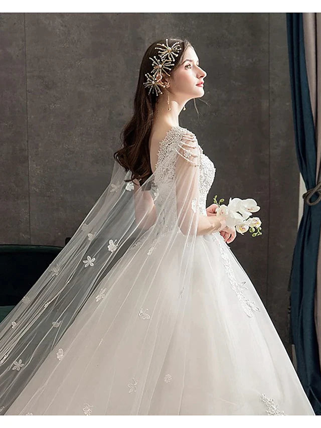Princess Ball Gown Wedding Dress featuring a jewel neckline and intricate lace tulle details.
